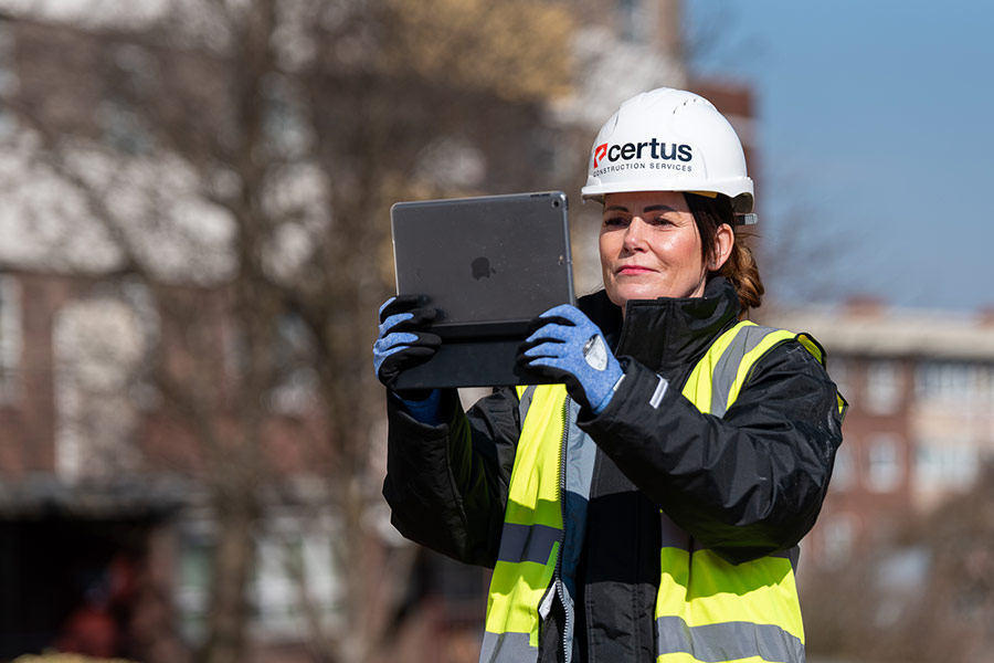 Certus project manager studying a tablet