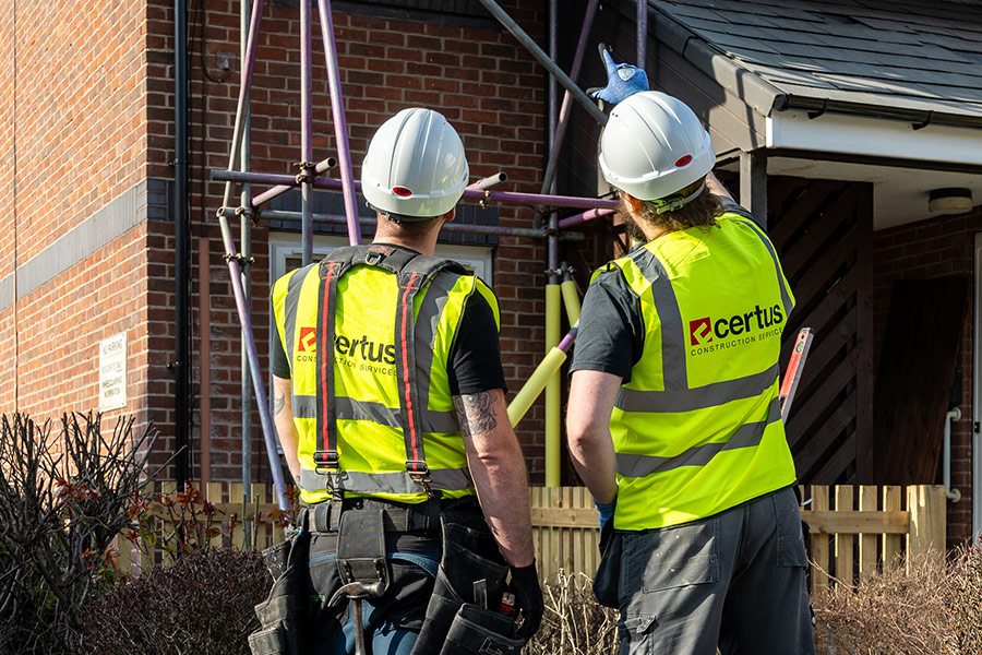 Certus construction workers surveying a property
